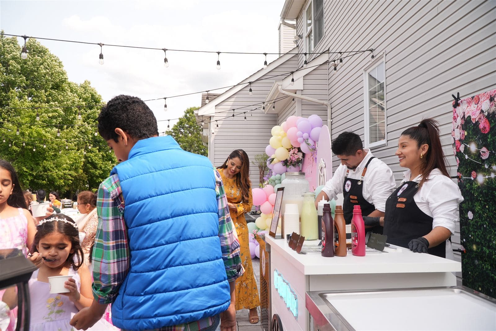 Rollitos catering cart serving guests at a backyard party