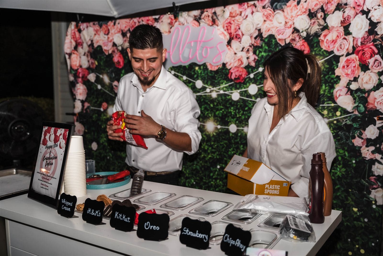 Topping bar setup for a graduation party at night