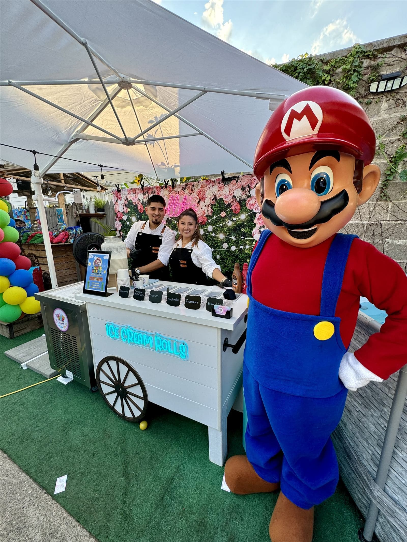 Rollitos ice cream cart under an umbrella at a Super Mario themed birthday party